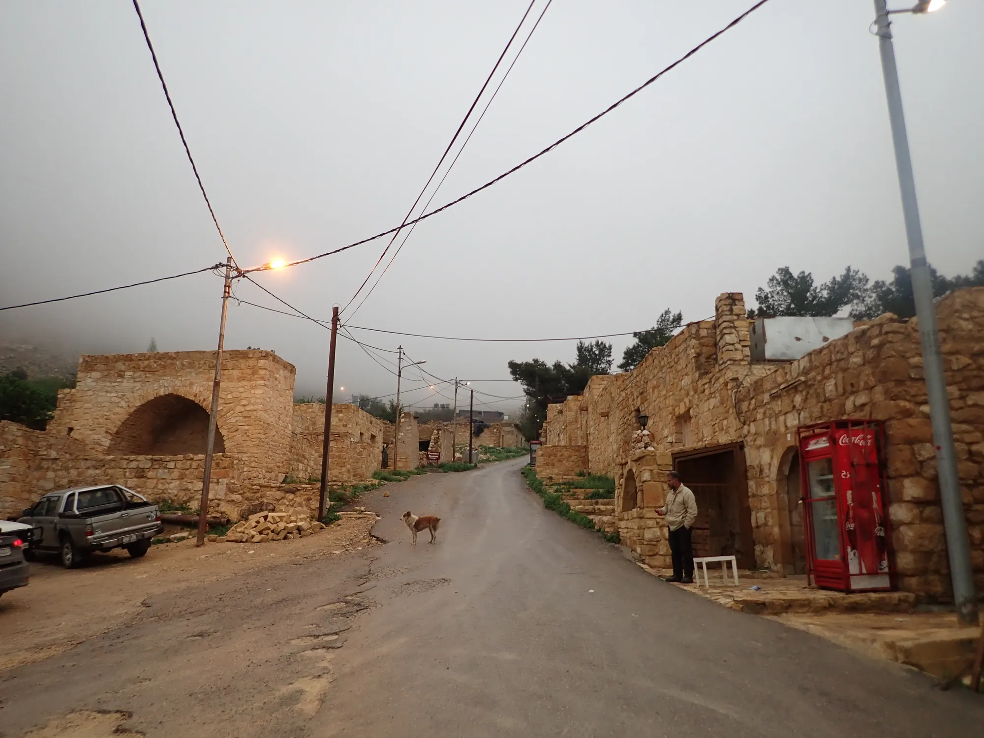 Evening in the stone village of Dana in the fog