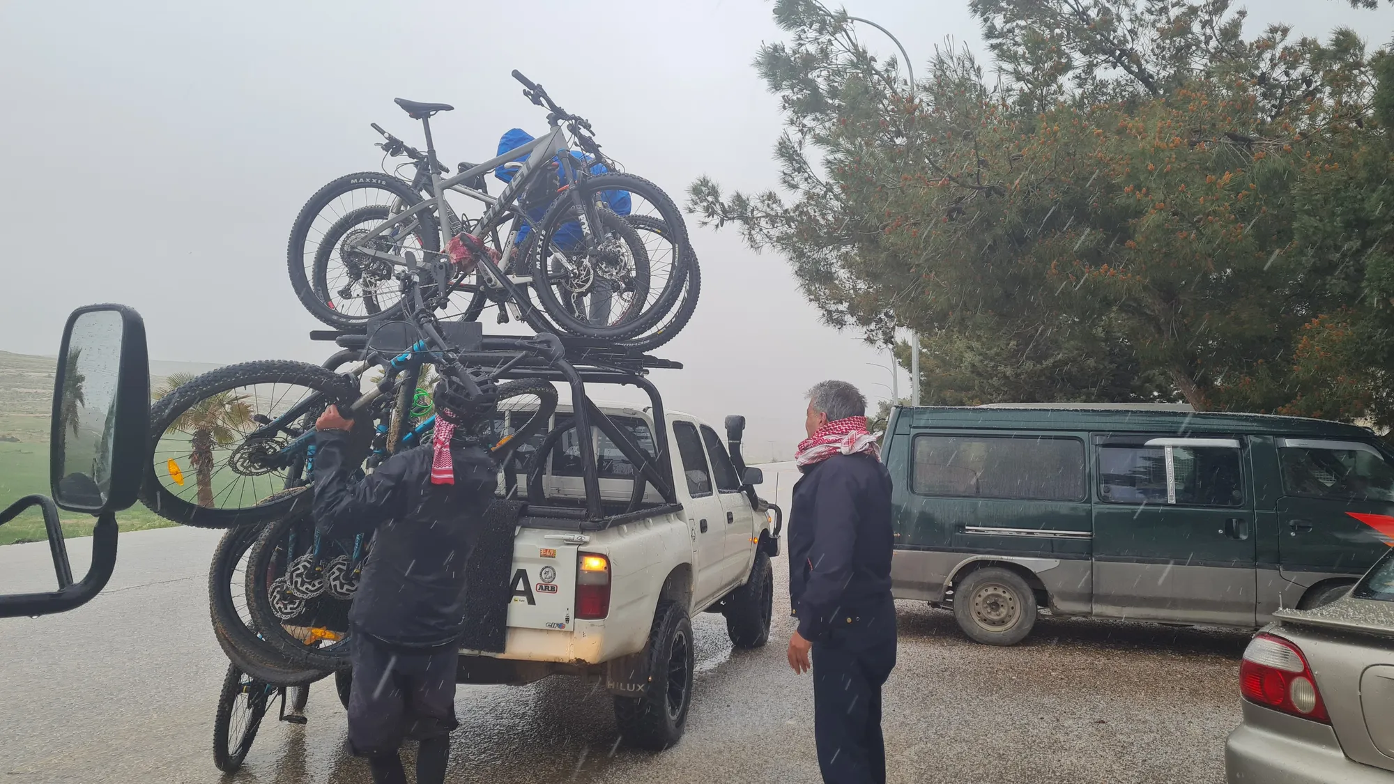 Mountain bikes being loaded onto a pickup