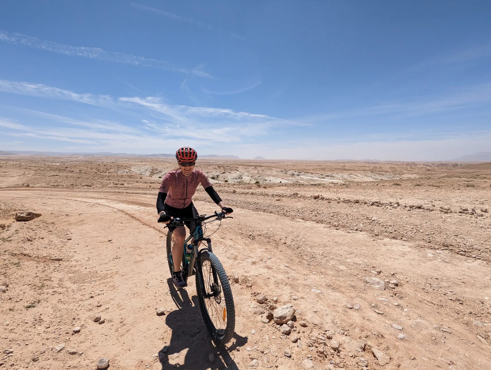Riding a mountain bike along a desert track in Jordan