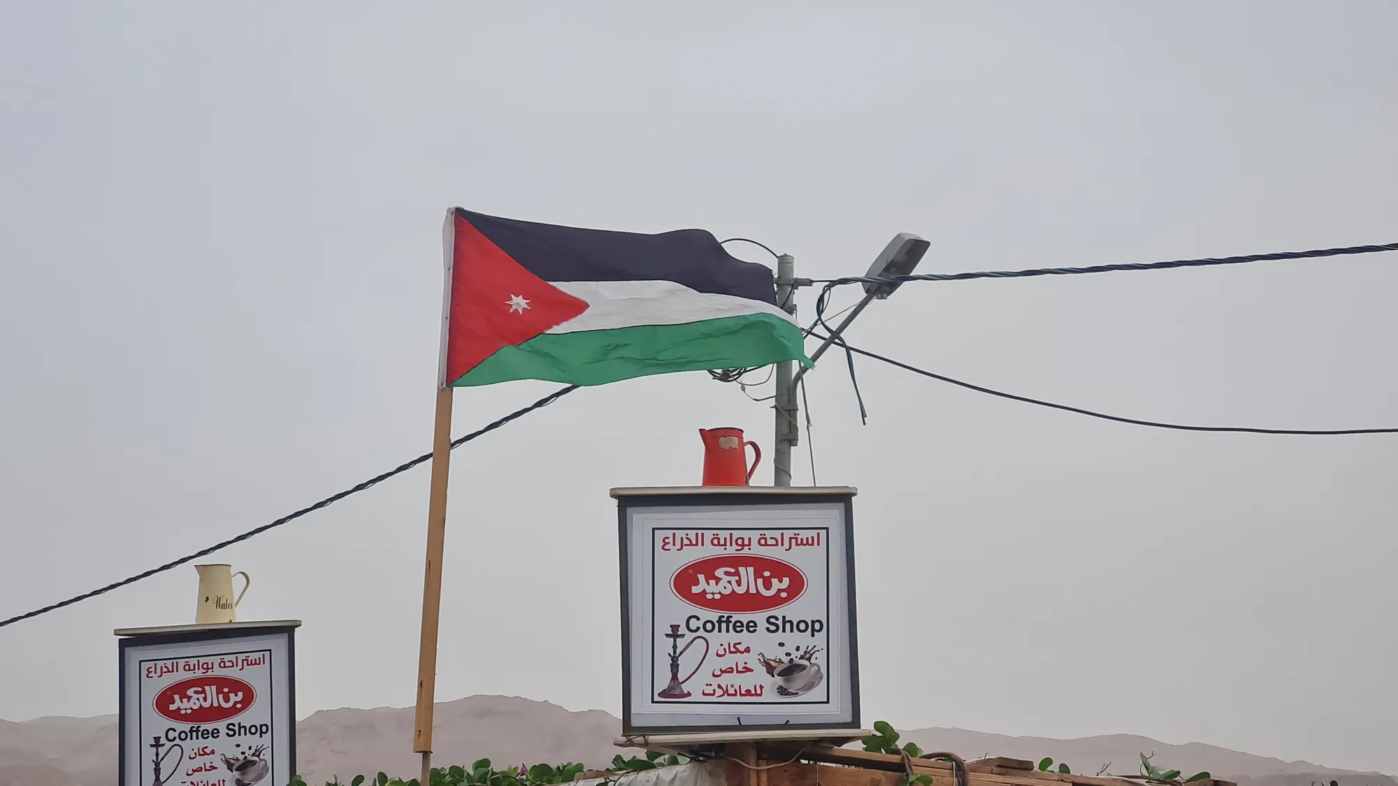 Roadside coffee shop with the Jordanian flag