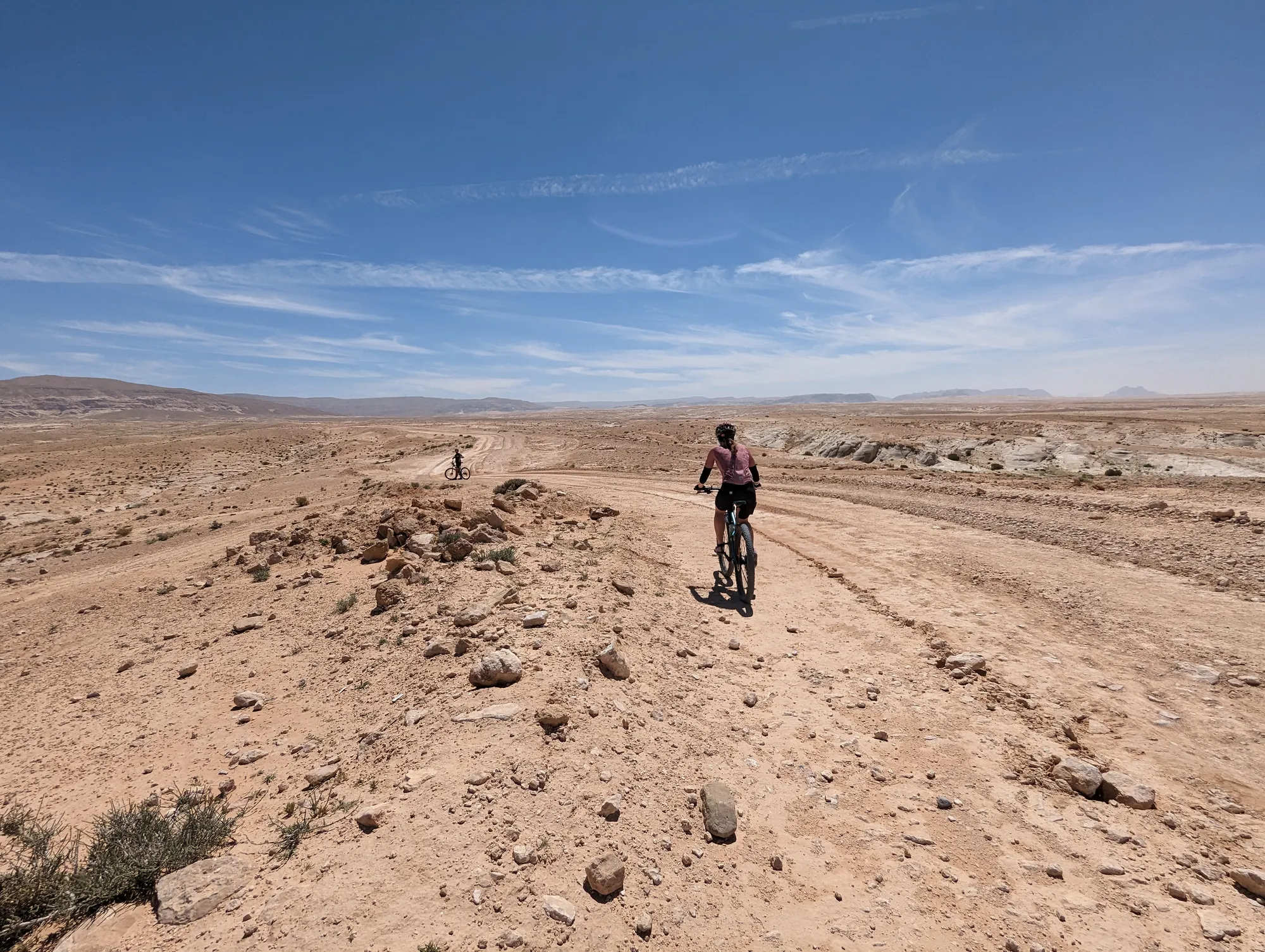 On a desert track under a blue sky
