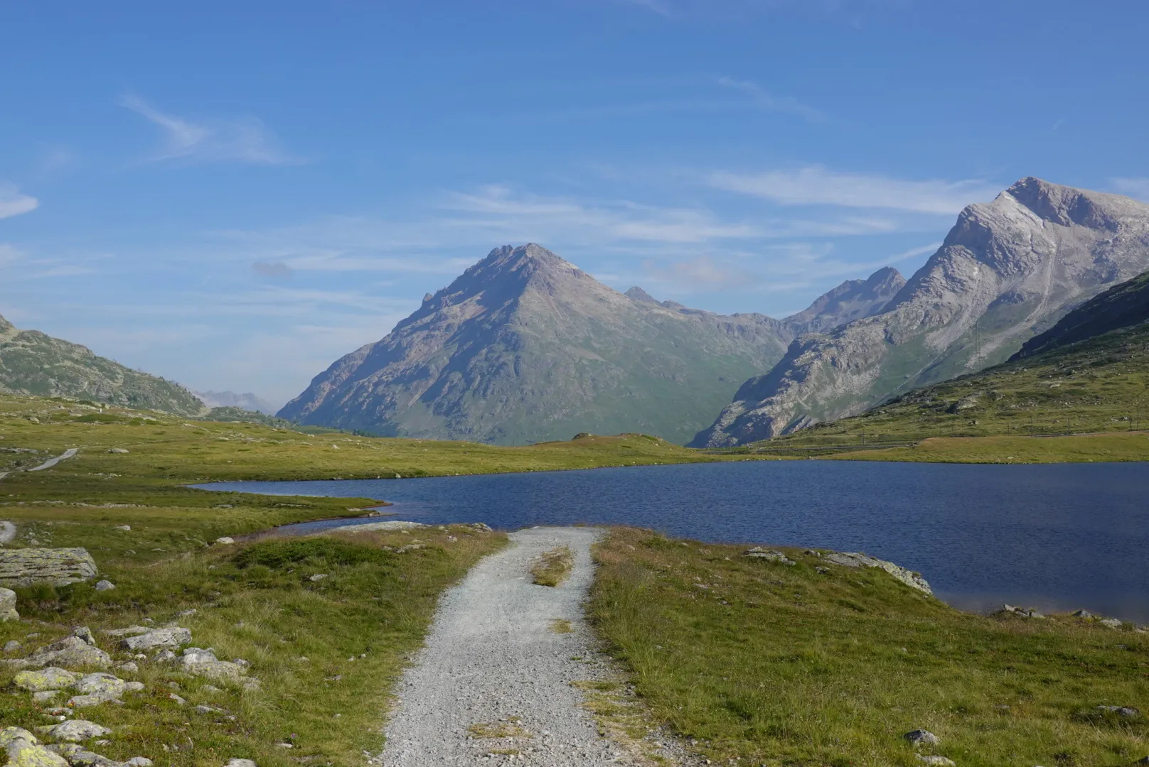 Gravel track along Lago Bianco on the Bernina Pass
