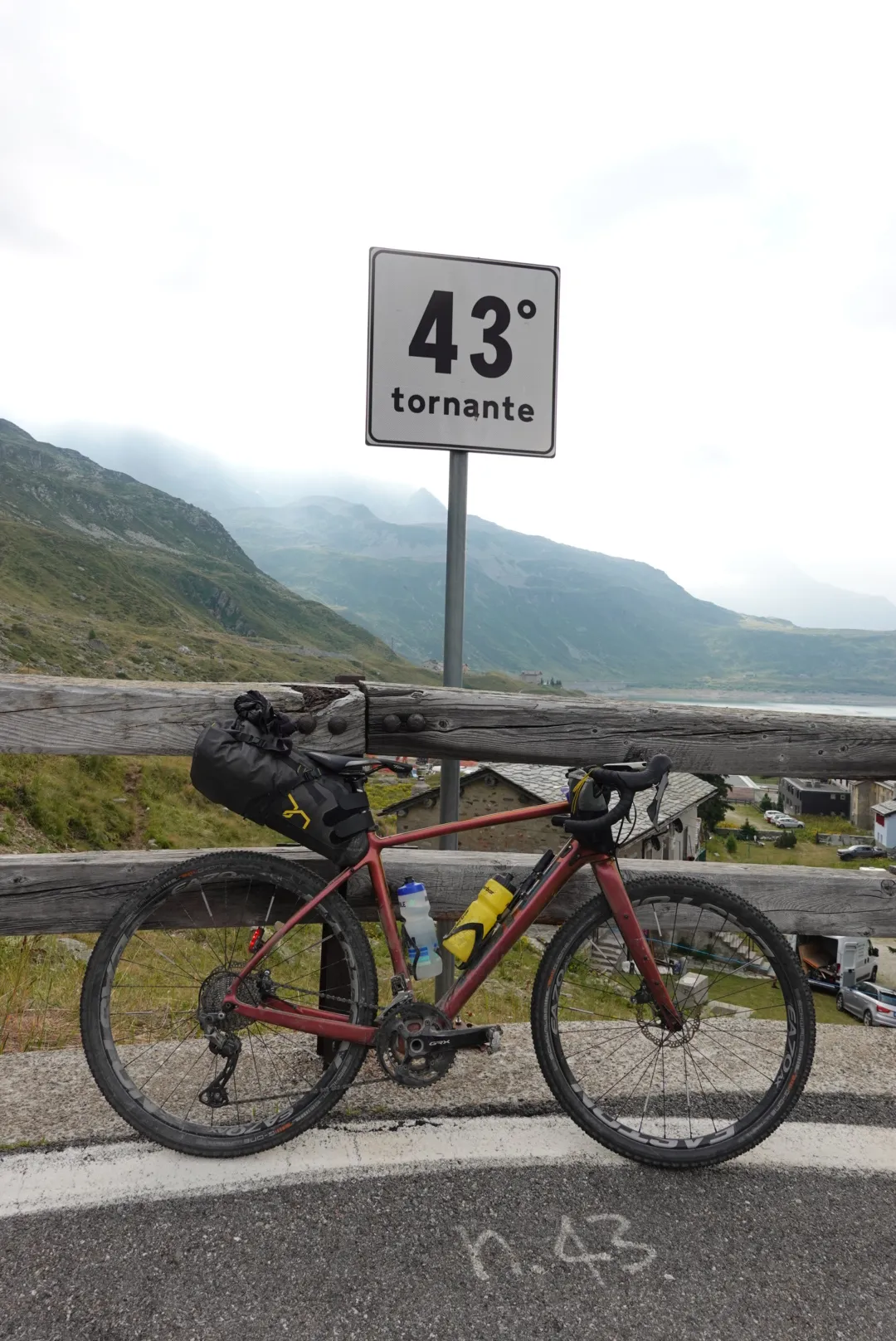 Gravel bike at hairpin number 43 on the Splügen Pass road