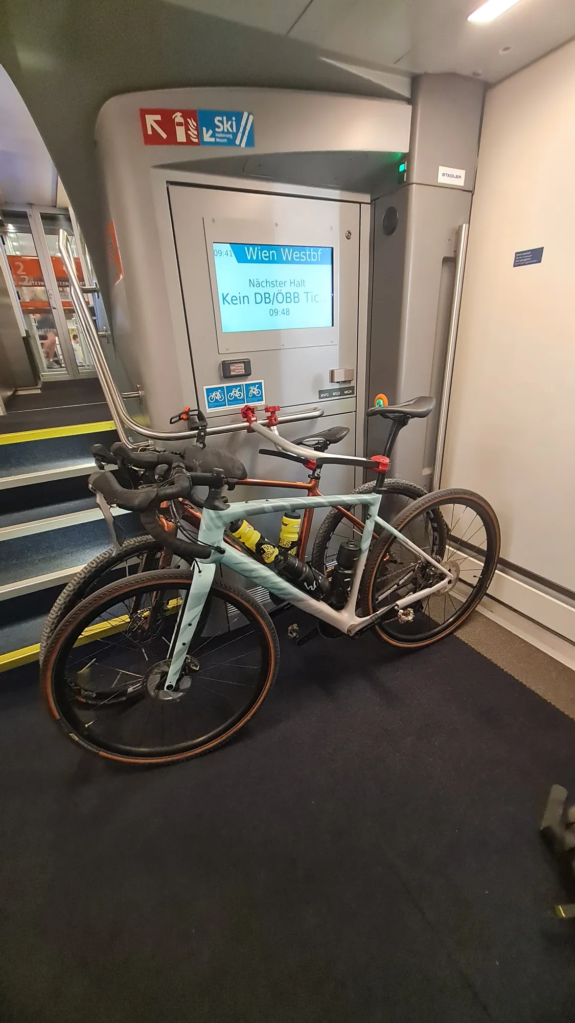 Four loaded bikes in the bike compartment of the Westbahn train