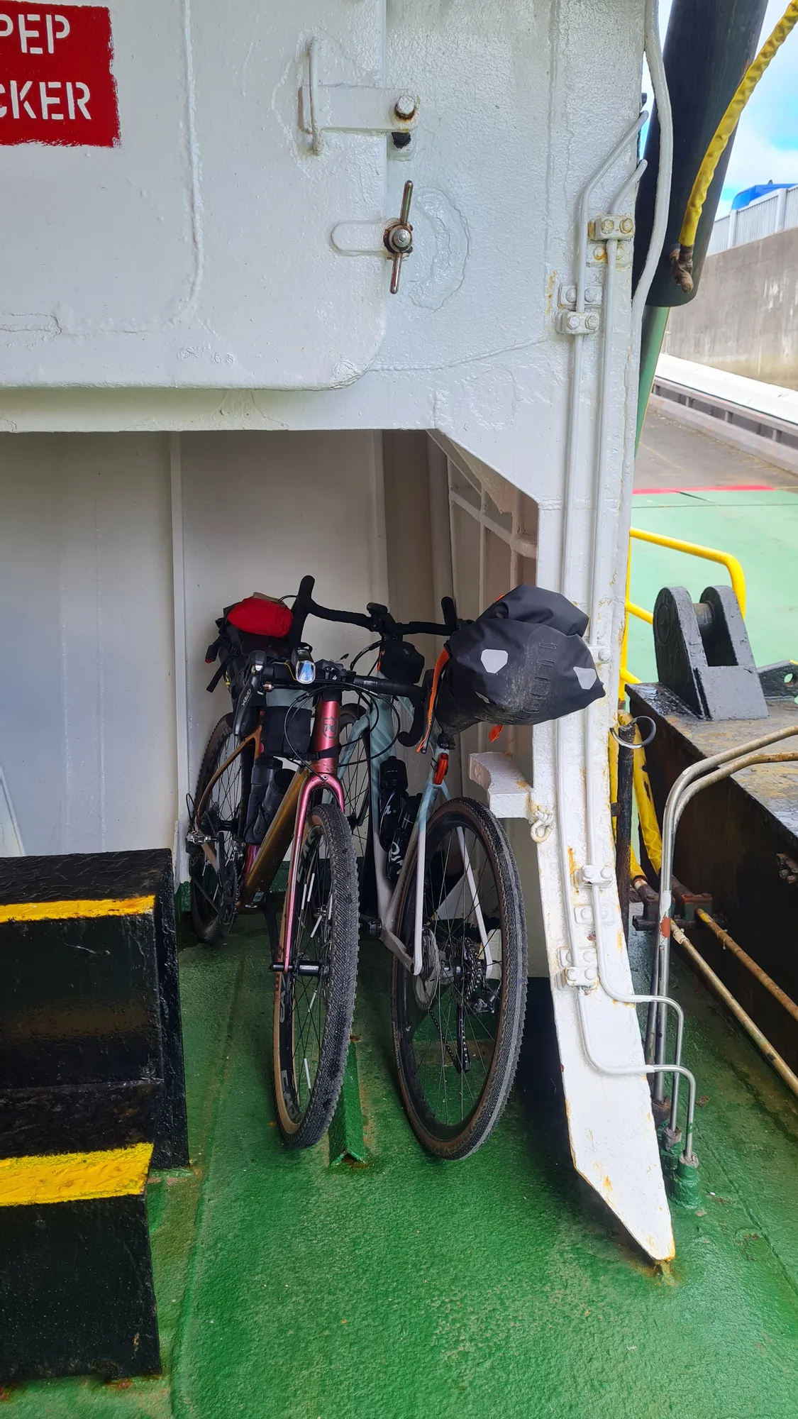 The bikes against the wall of the ferry to Skye