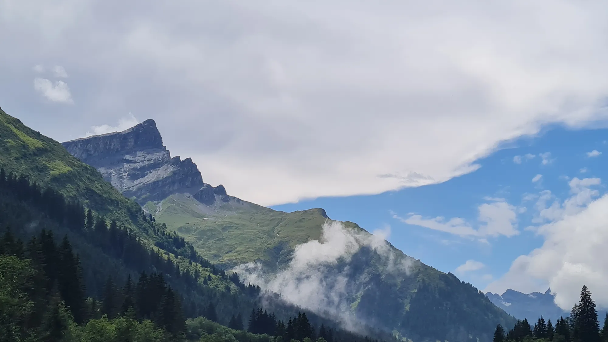 Shreds of cloud on the rocky peaks above the Rheinwald