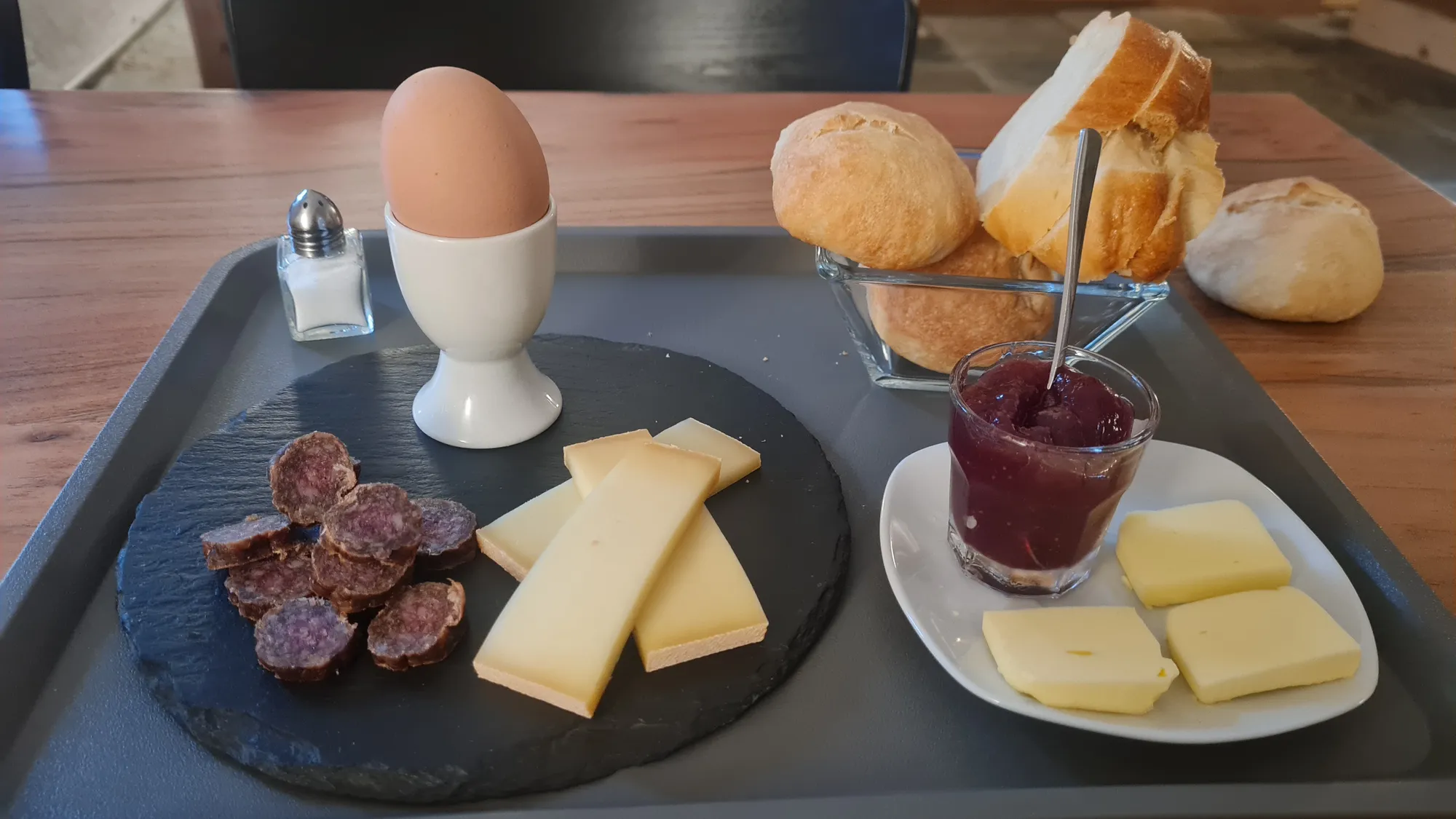 Breakfast with egg, cheese, dried sausage and jam