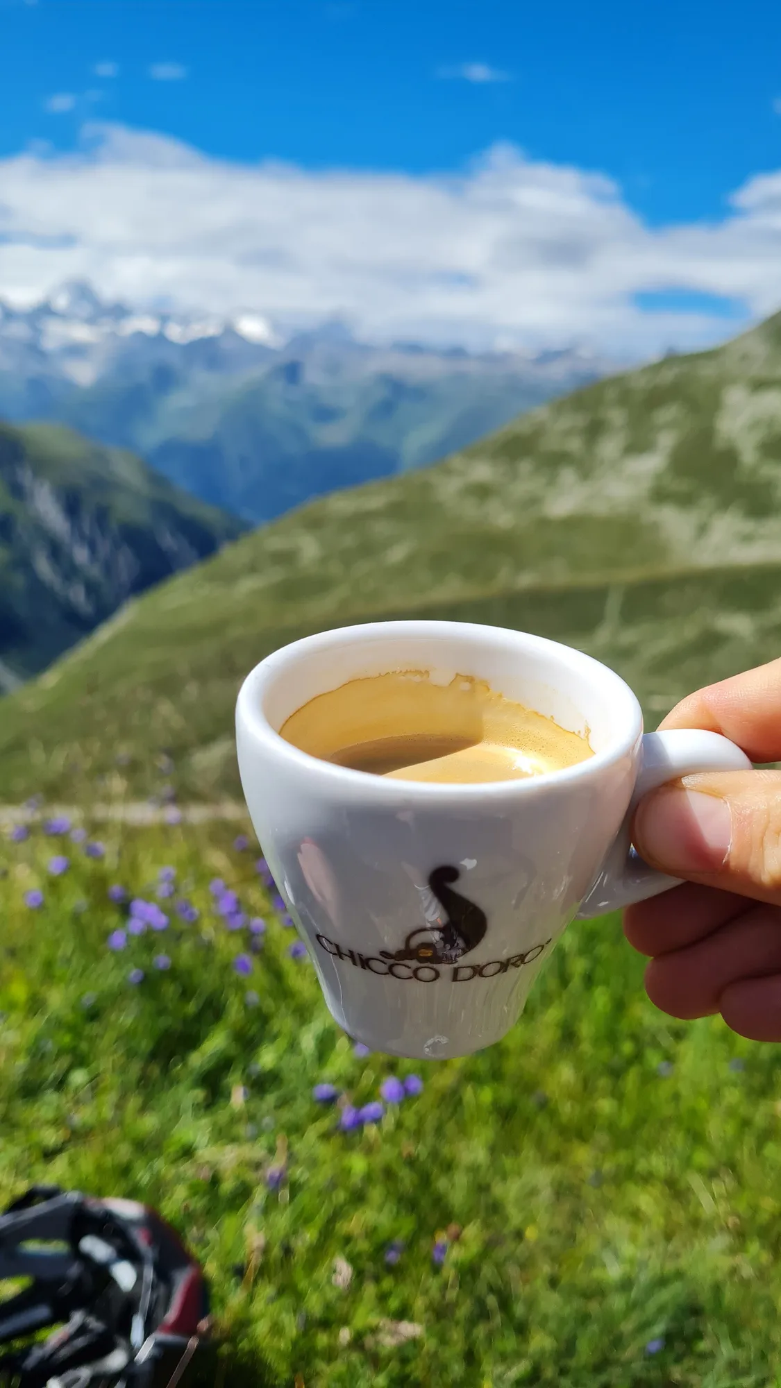 Espresso on the Nufenenpass, snowy mountains behind