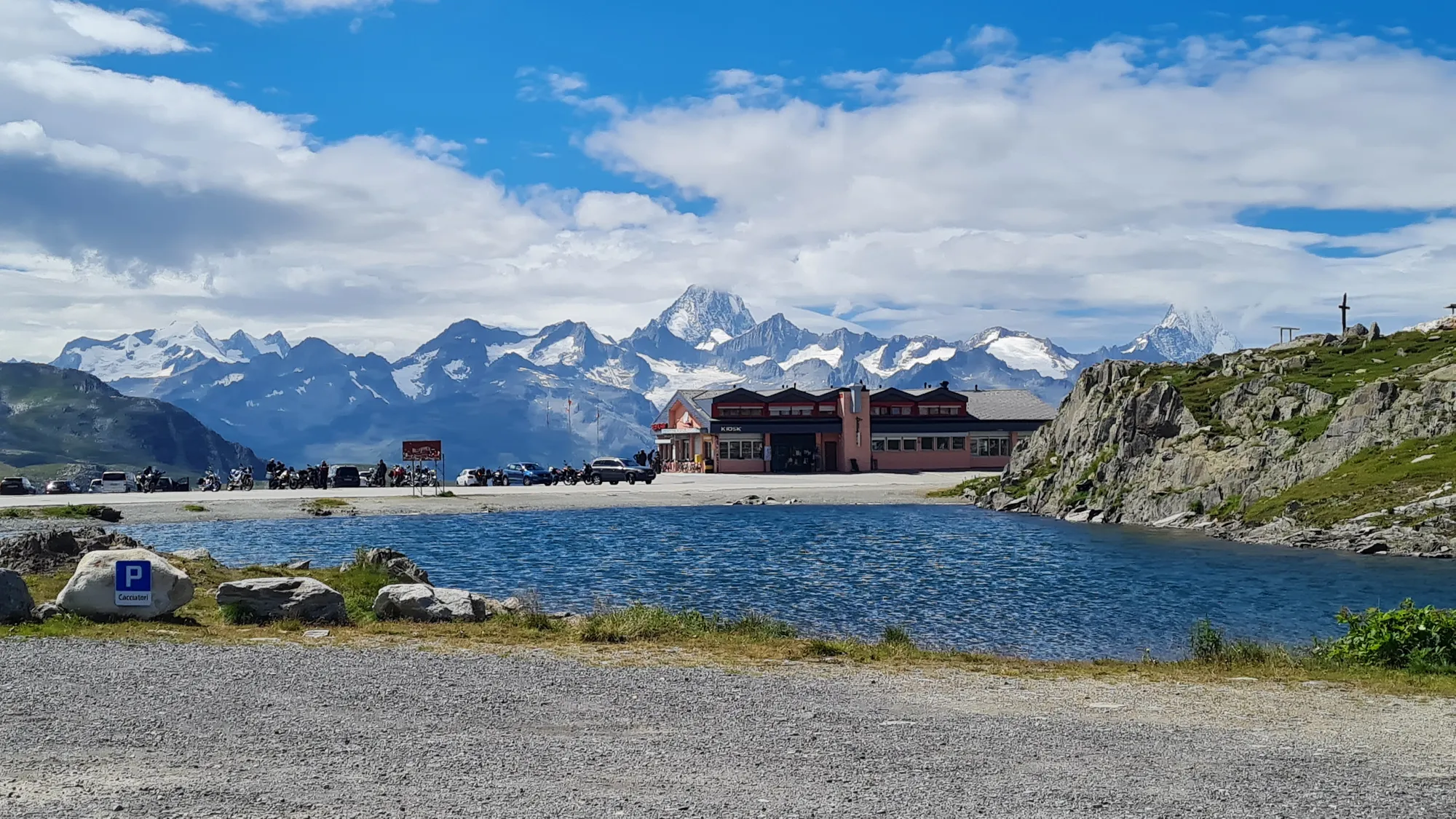 Mountain lake on the Nufenenpass with a view of snow-capped peaks